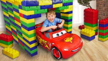 Giant Lego Garage – Family Builds a Home for a Red Ride-On Car